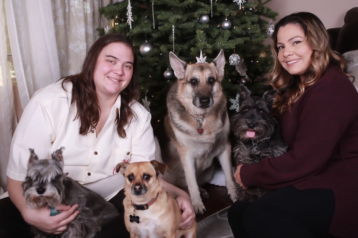 Reyna and Nicole Kline at home with four of their rescue dogs