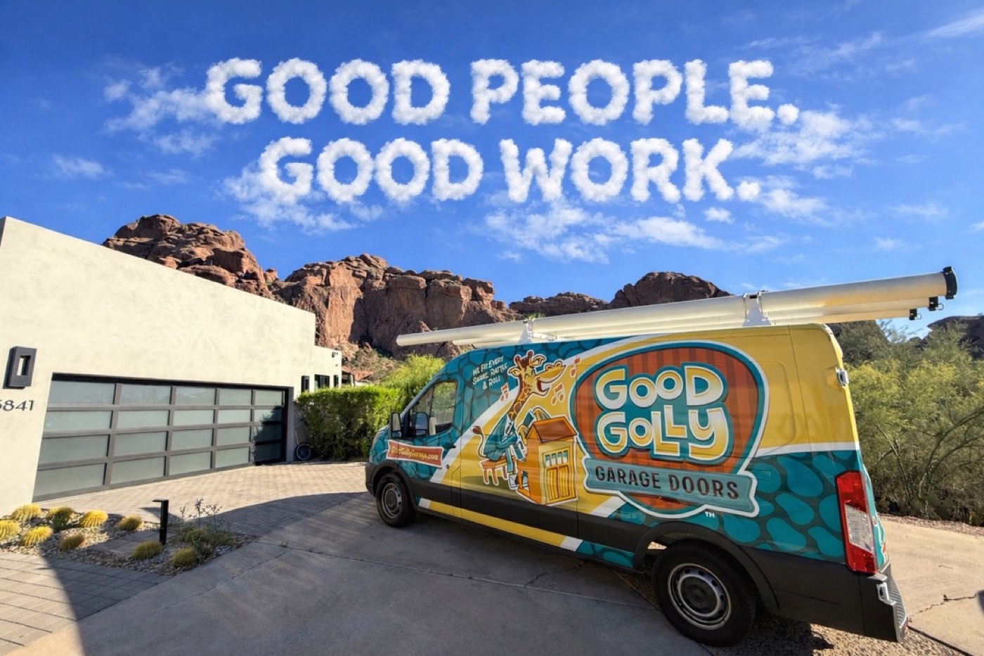 A Good Golly Garage Doors service van parked at a Phoenix-area home below the red rock foothills