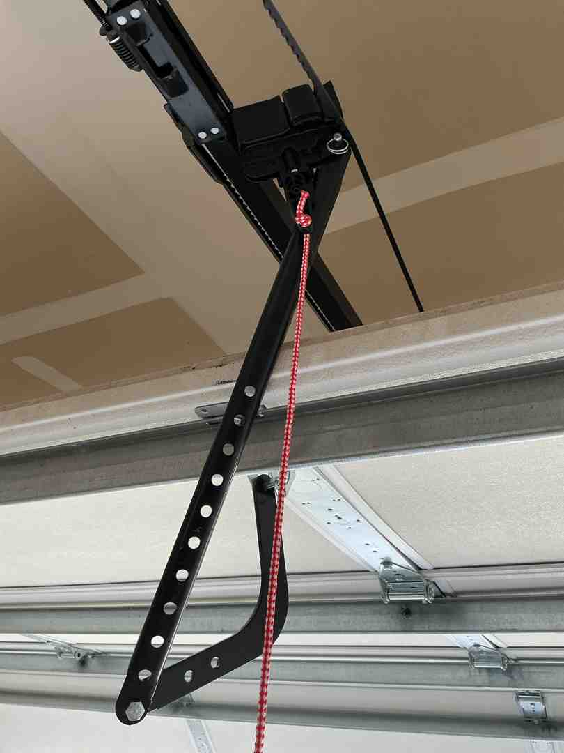 zip tie secured to a garage door emergency release lever