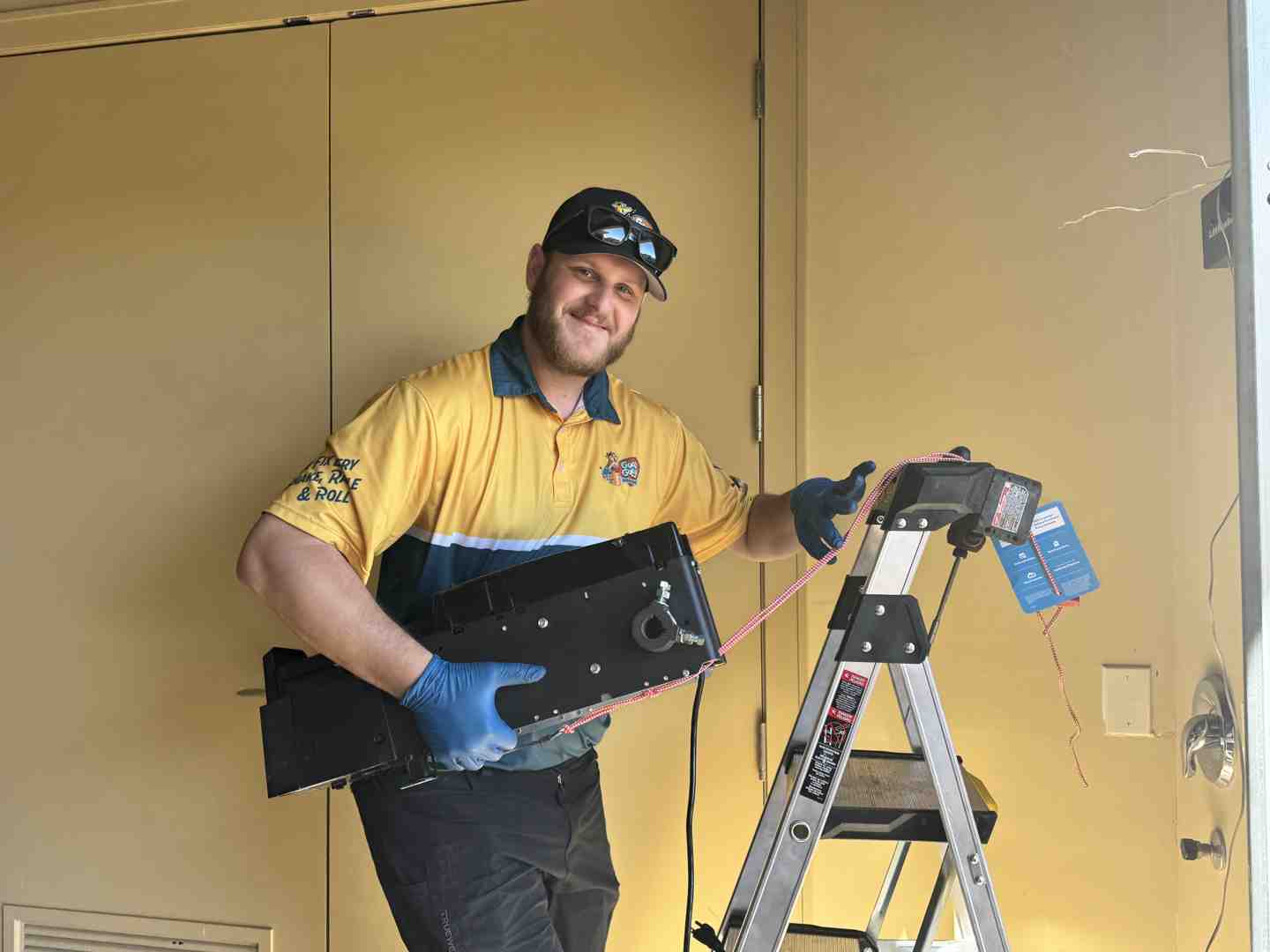 technician evaluating garage door motor