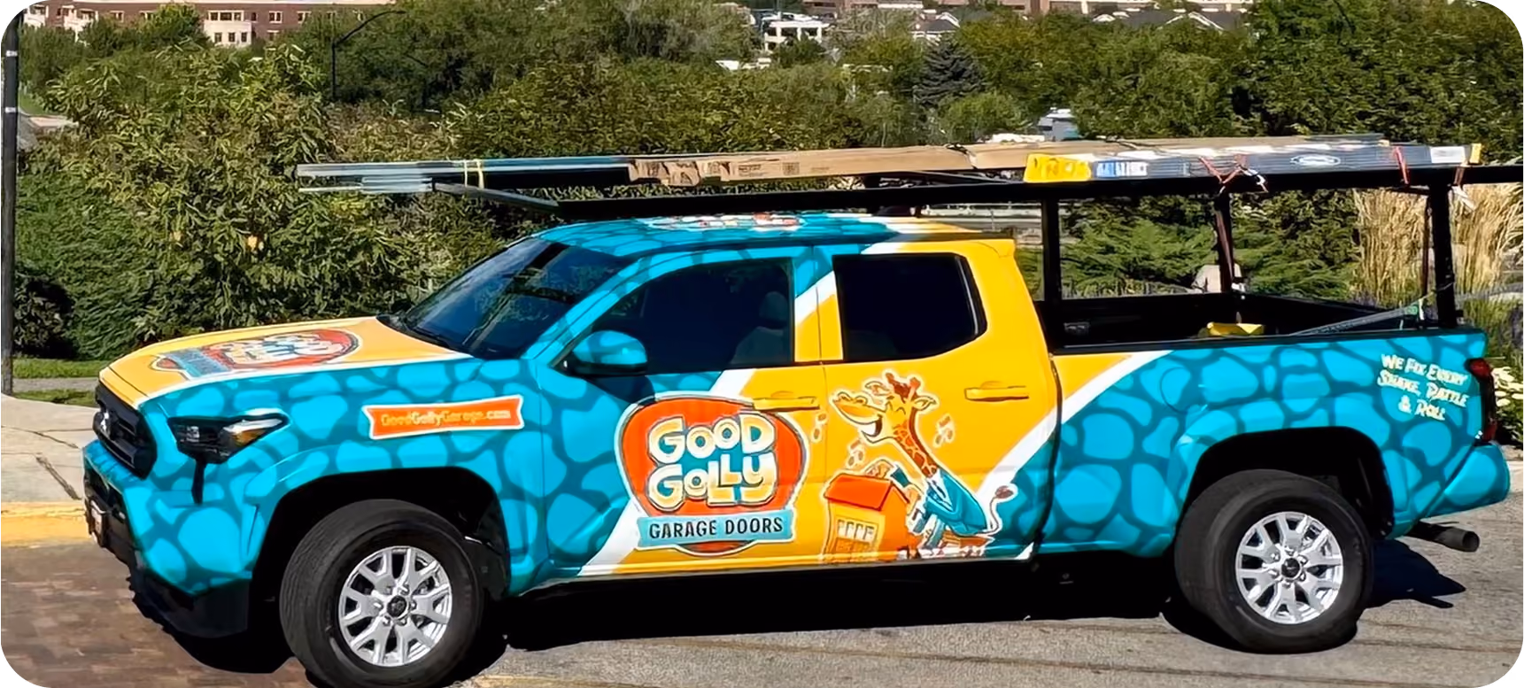 A Good Golly technician loading a garage door panel from the Boise service truck