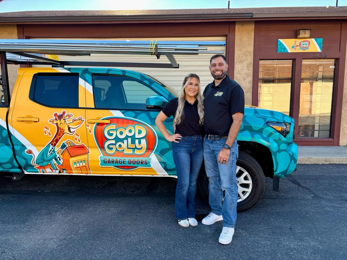Roland and Alesha Serb beside their wrapped Good Golly service truck outside the Boise shop