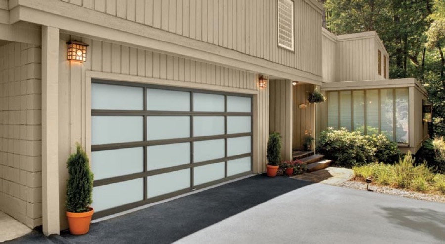 An Amarr Vista aluminium full-view garage door with clear glass panels
