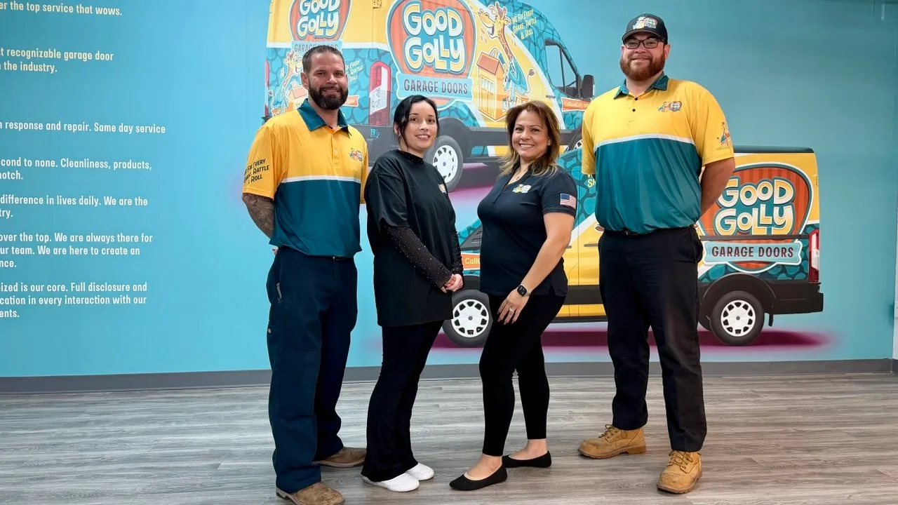 Good Golly Garage Doors team members in uniform at a location office