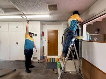 Good Golly Garage Doors technicians installing a Las Vegas garage door